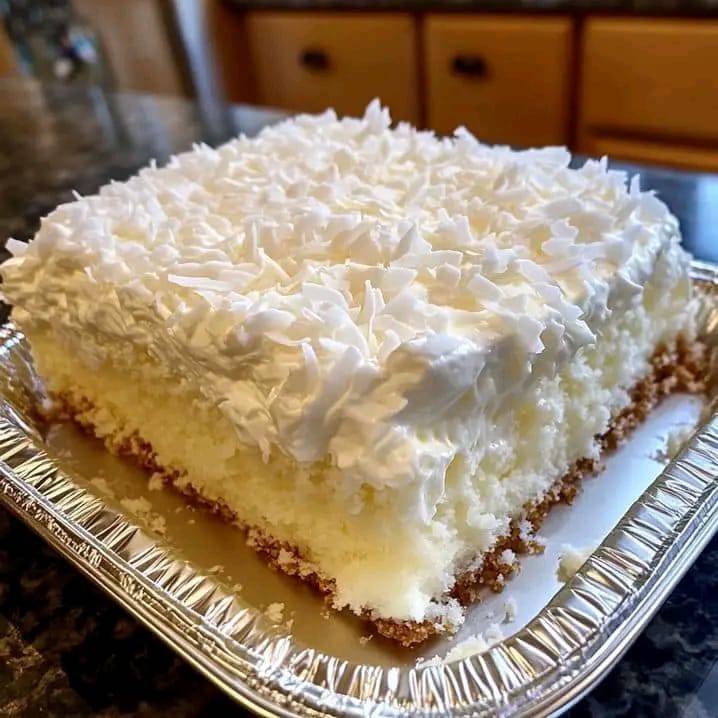 Coconut Cream Dream Cake: A Slice of Paradise 480197280_1159957369103987_1016391391280137272_n